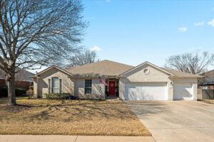 Angled front view of the Round Rock Assisted Living brick home and driveway