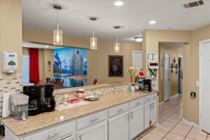 Kitchen counter with granite tops and a resident coffee station